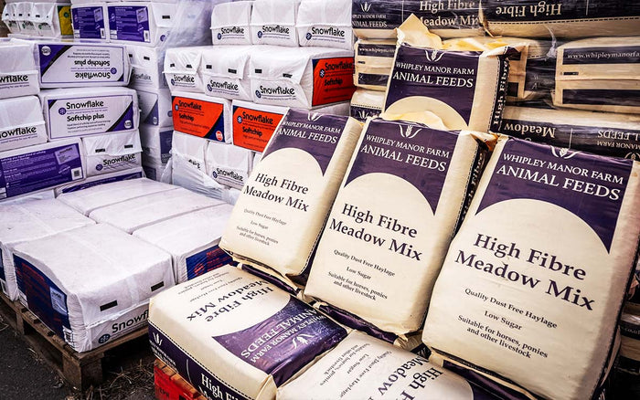 Pallets of Whippy Manor Farm High Fibre Meadow Mix animal feed bags.

