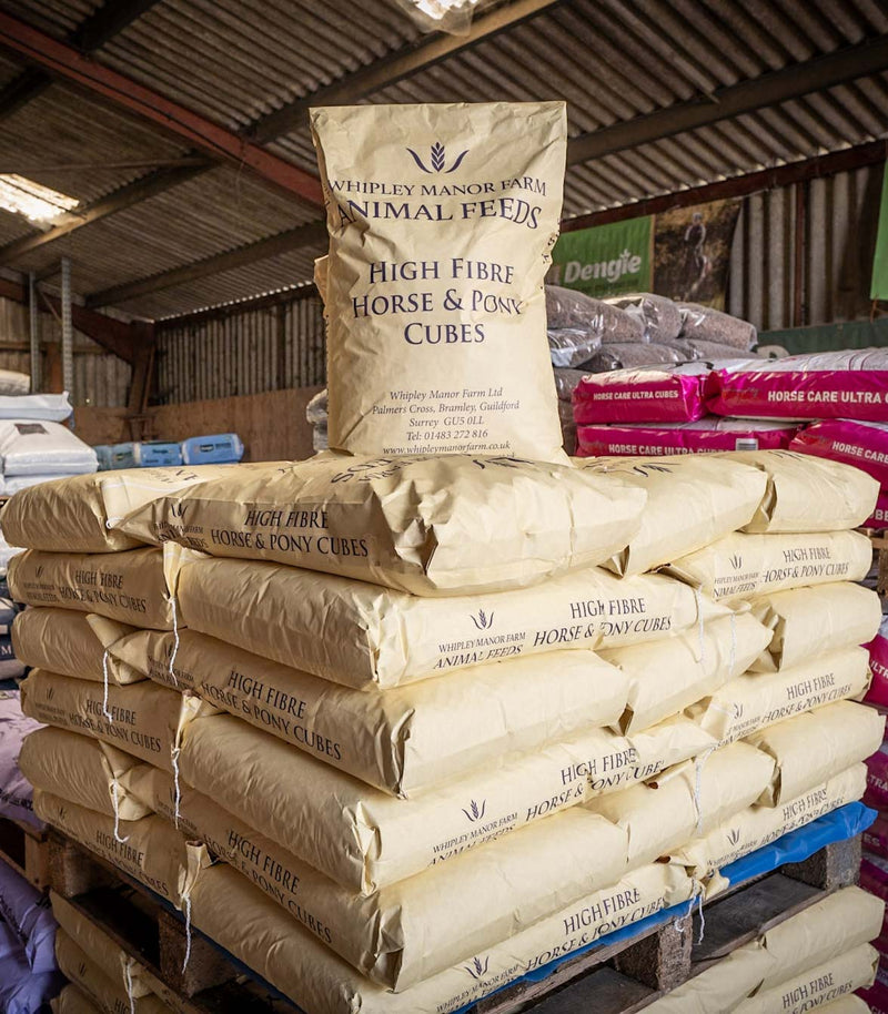 Stack of Whitley Manor Farm Animal Feeds bags on a pallet